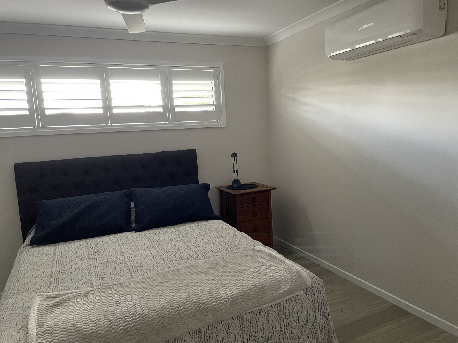 2nd Bedroom with QS bed, sliding robe, air conditioning and TV.