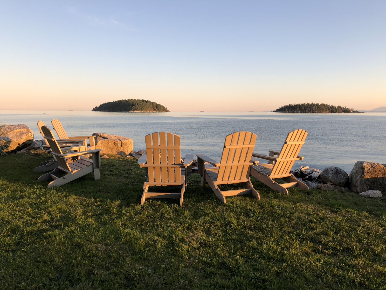 Catch the sunrise from the kitchen window, deck or bring your coffee to enjoy from these chairs to b ...