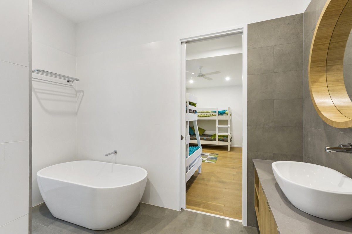 Main three way bathroom, with freestanding bath and large shower.