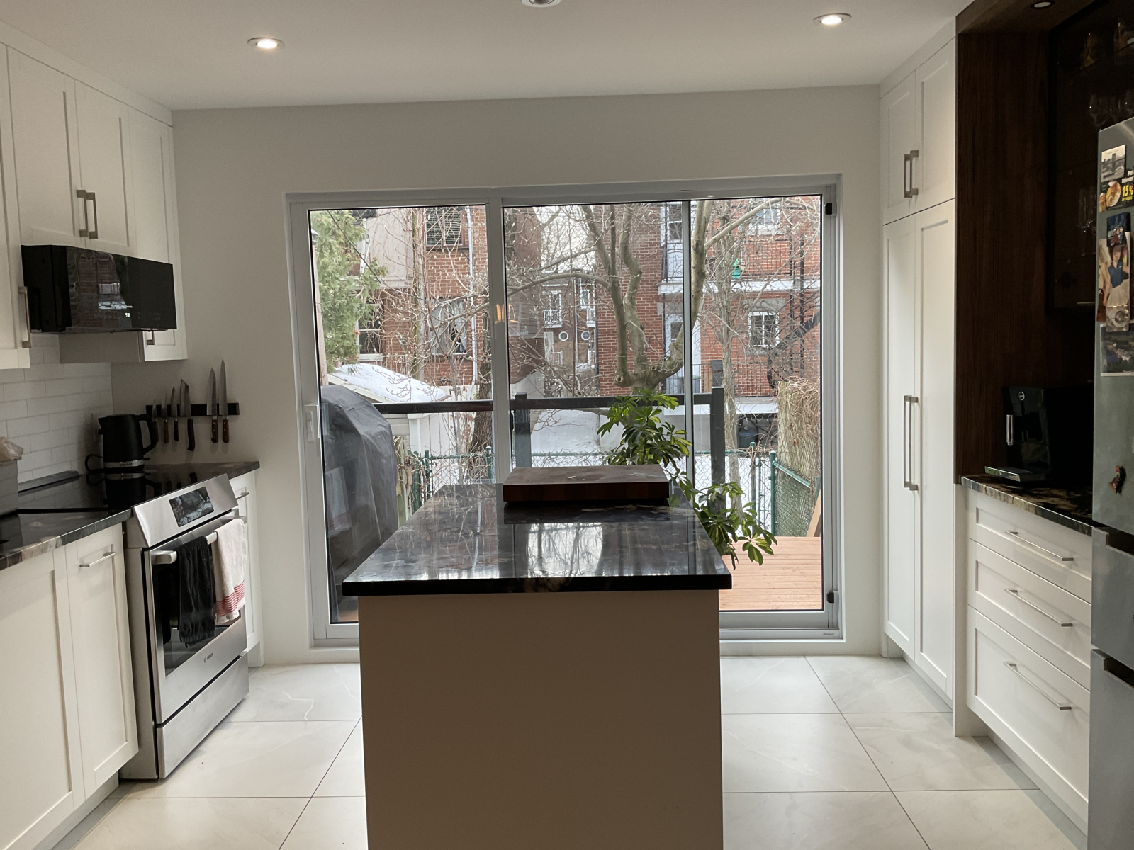 Kitchen opening onto the outdoor terrace and intimate courtyard.