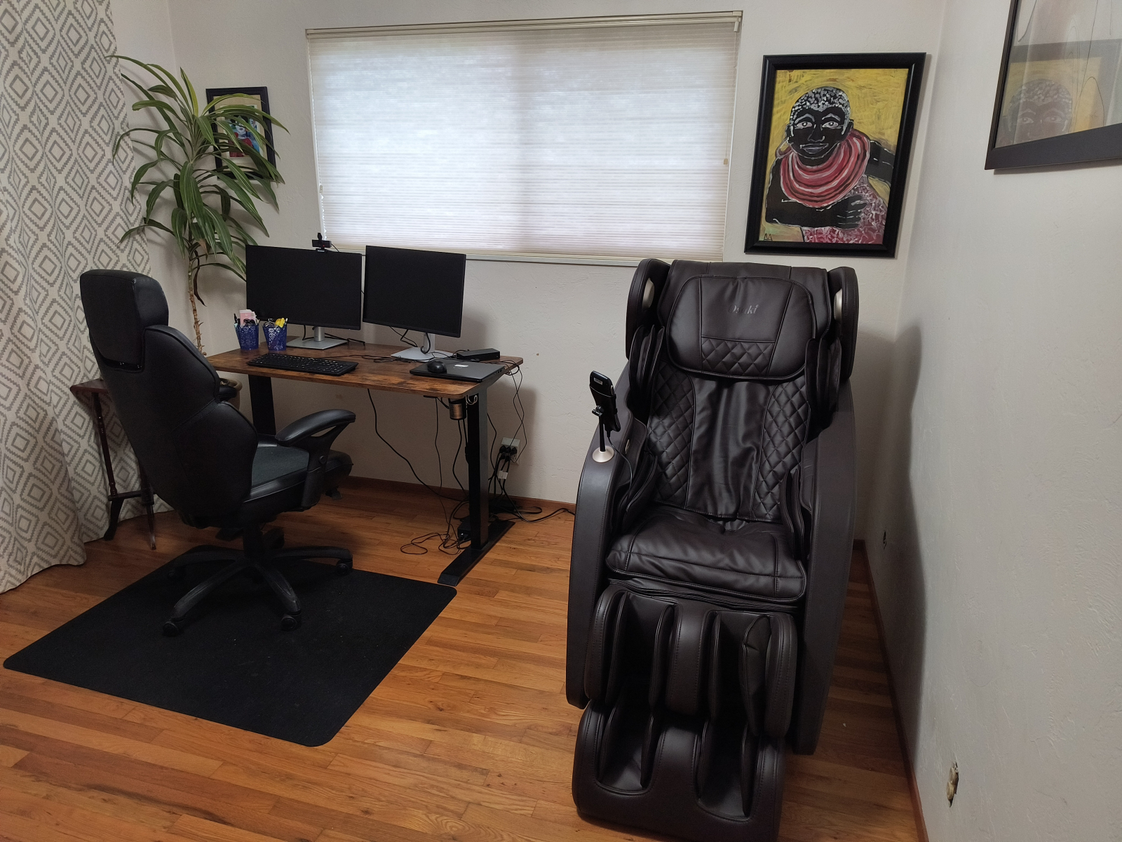 Second bedroom used as an office with a massage chair.