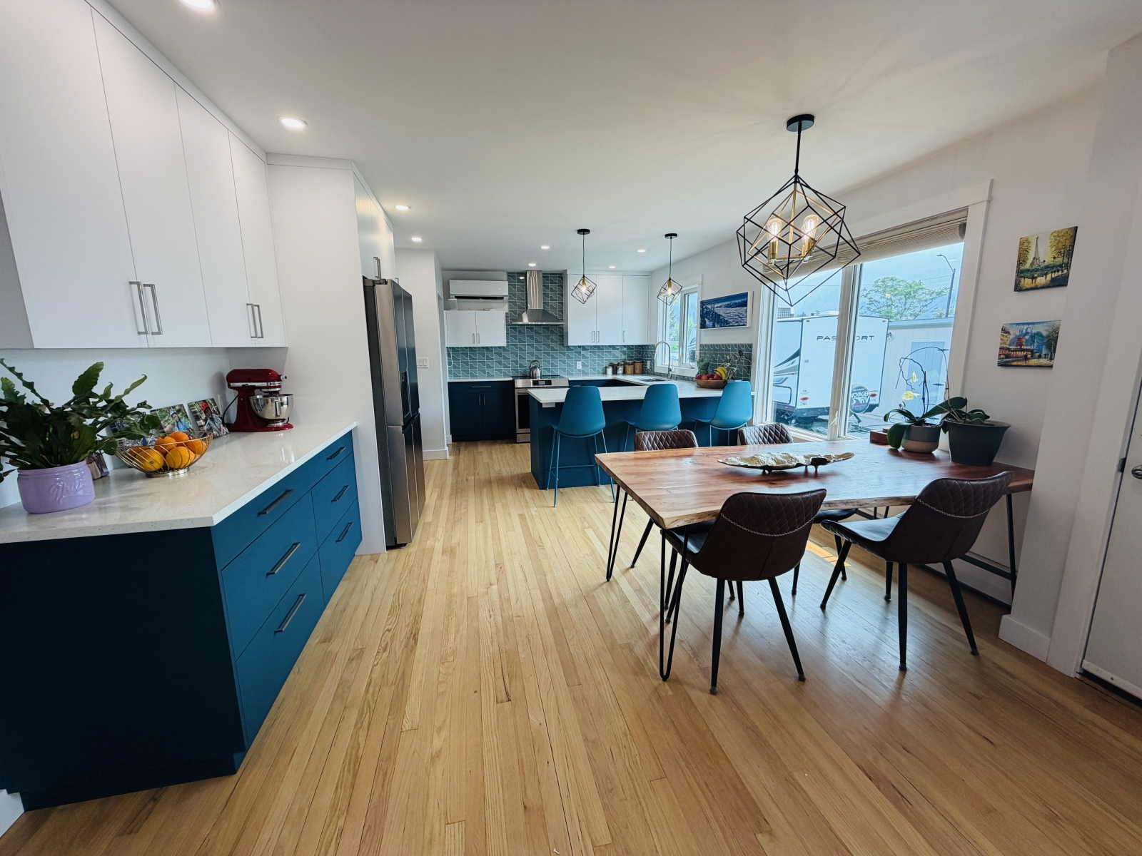 New kitchen with reclaimed oak floorboards. Induction cooker.