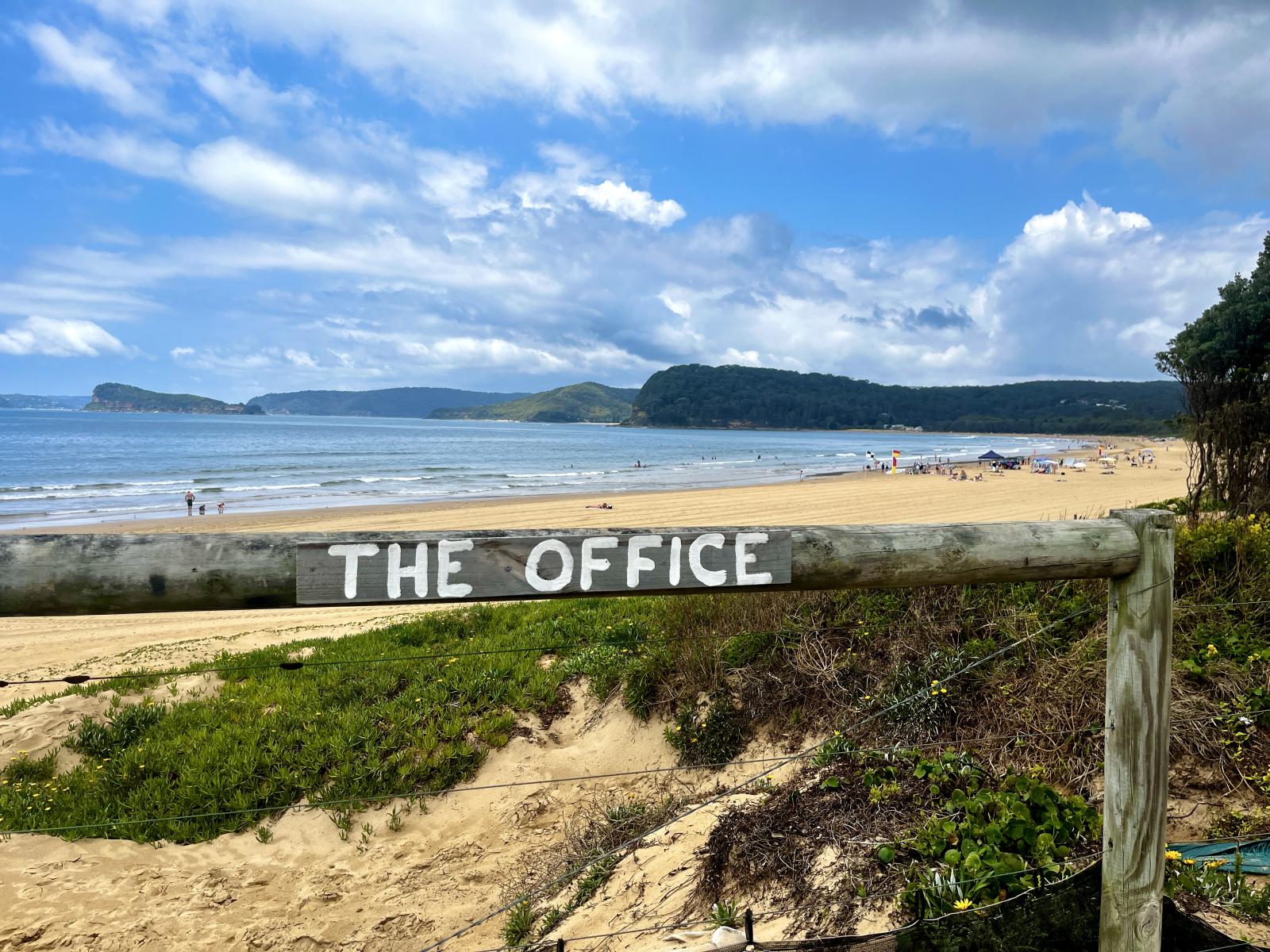 Our beach - it’s quiet and the sea is calm. There are lifeguards positioned close for safety.