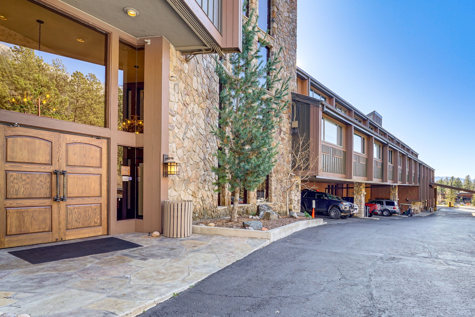 North entrance from parking lot leads to stairs and an elevator.
