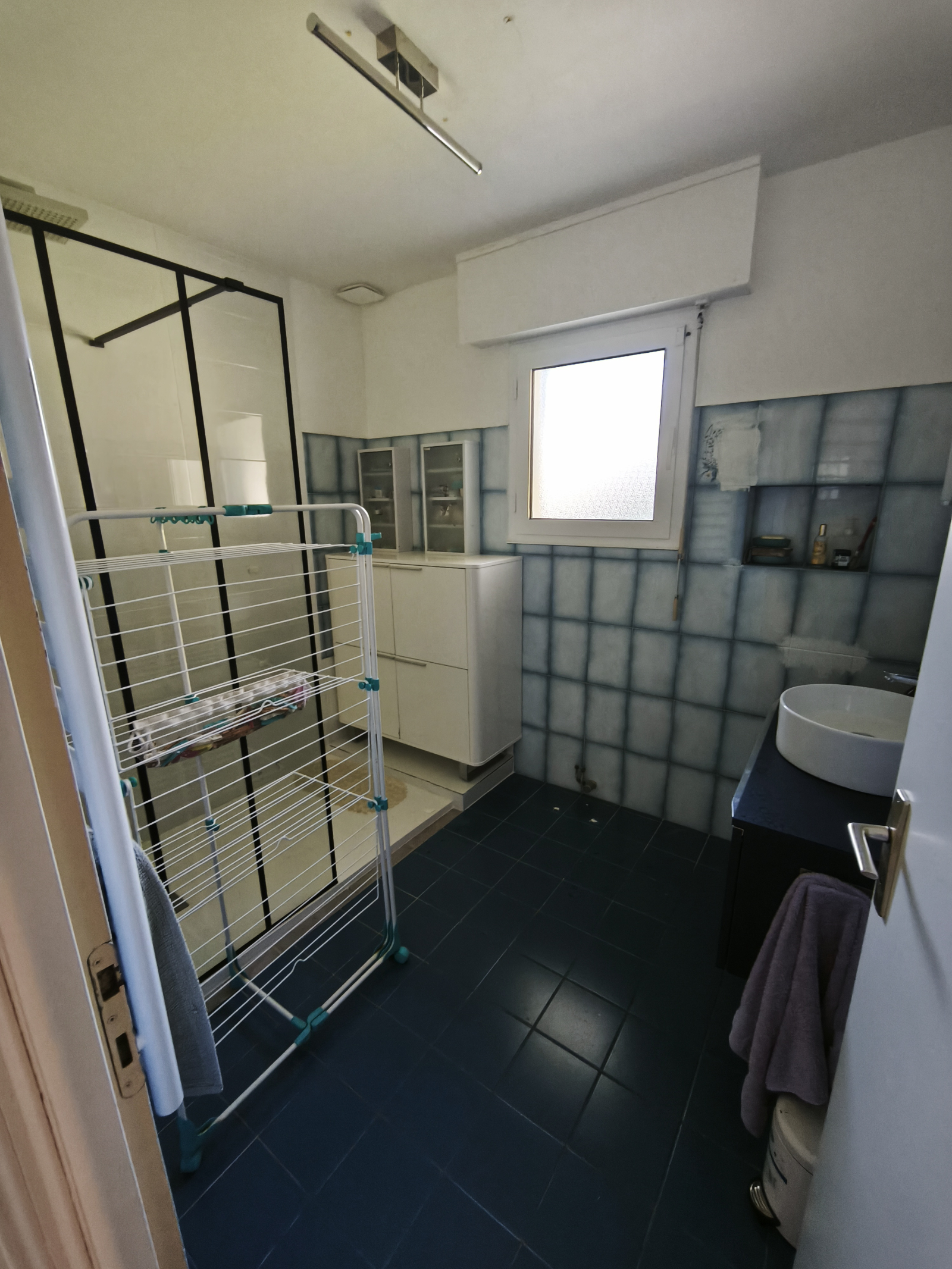 Downstaors bathroom with shower and sink.  Bath being added November '25.