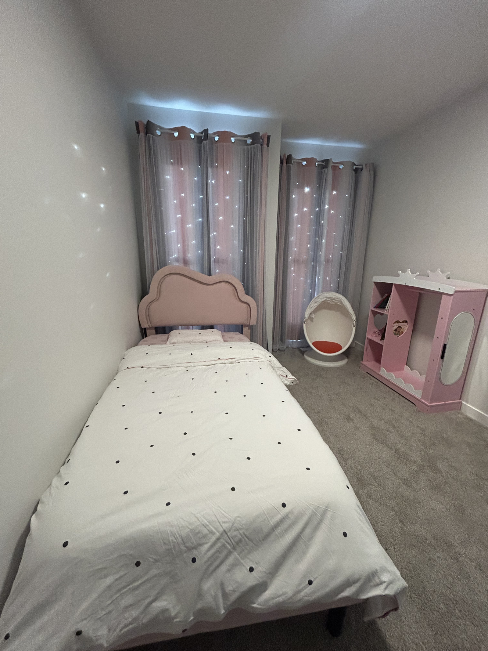 Comfortable and playful space with a twin bed, toy collection, and kids’ books for bedtime stories