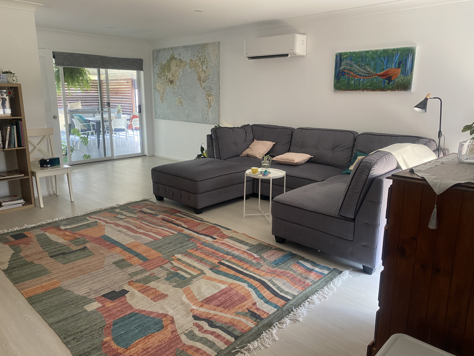 Main living area with corner lounge and second television
