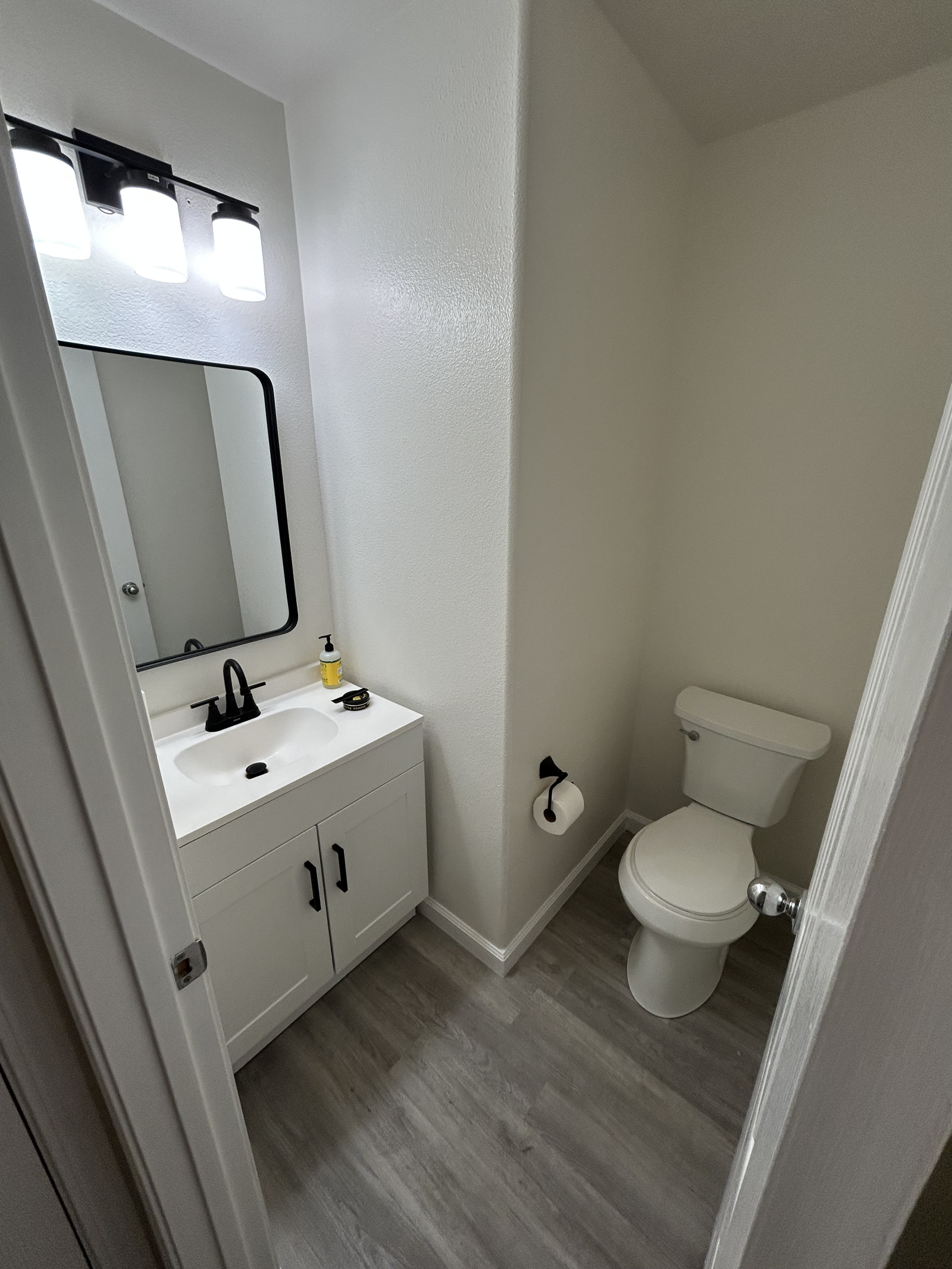 Half bath downstairs next to the kitchen