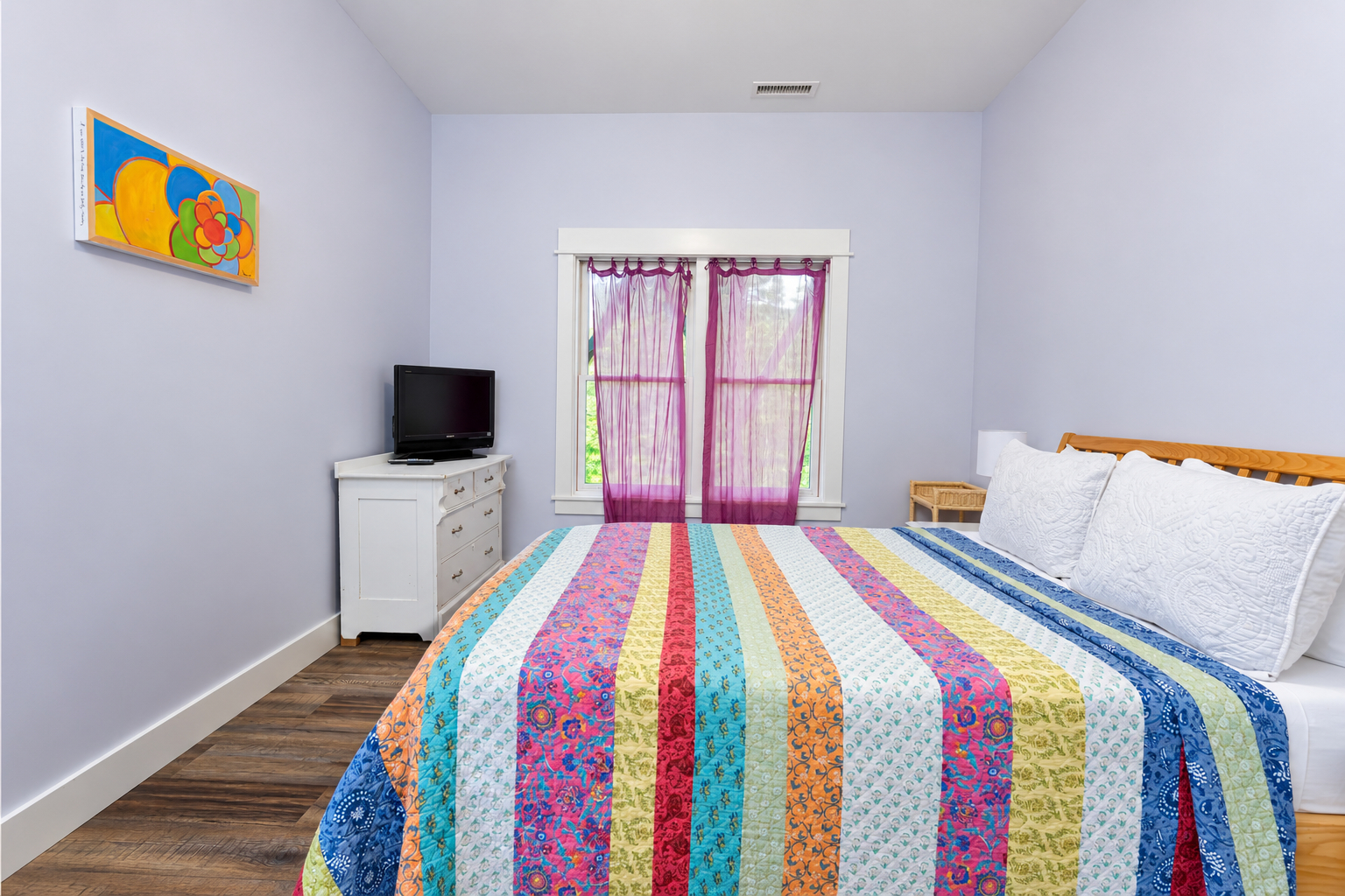 Down stairs bedroom with queen bed.