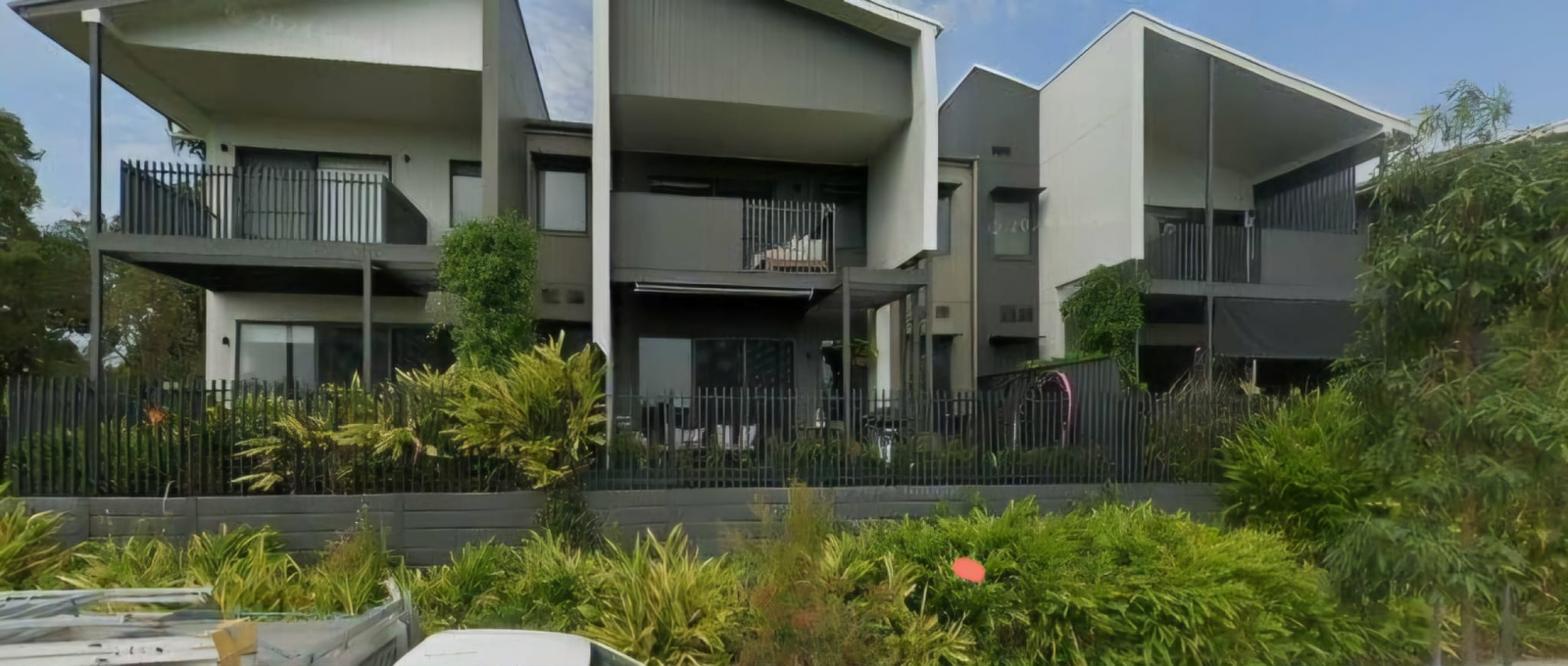 Townhouse is on far Left, at end of the Group and has a large green area of trees and lawns adjoinin ...