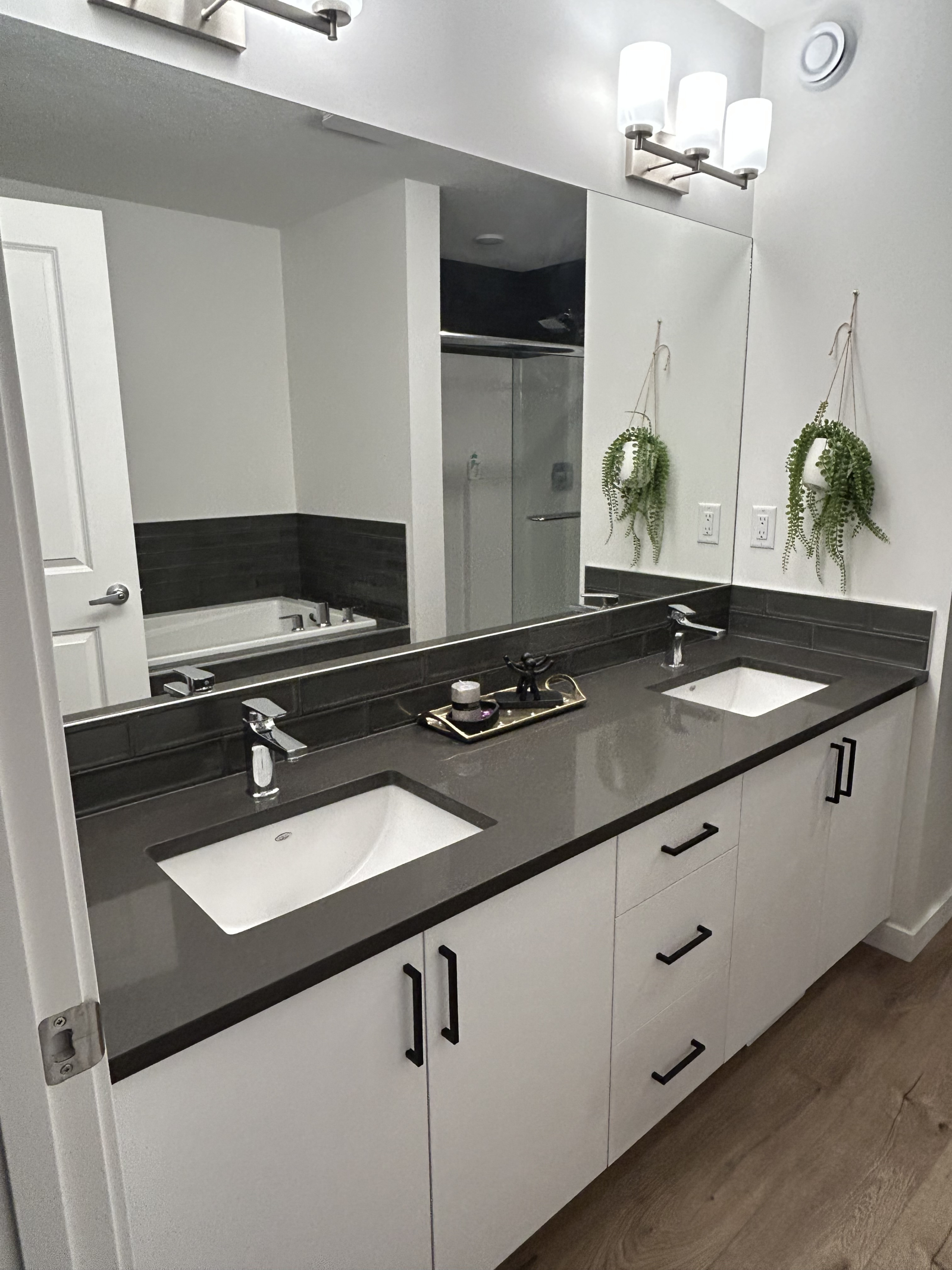 Master bathroom with tub, shower, and double sink