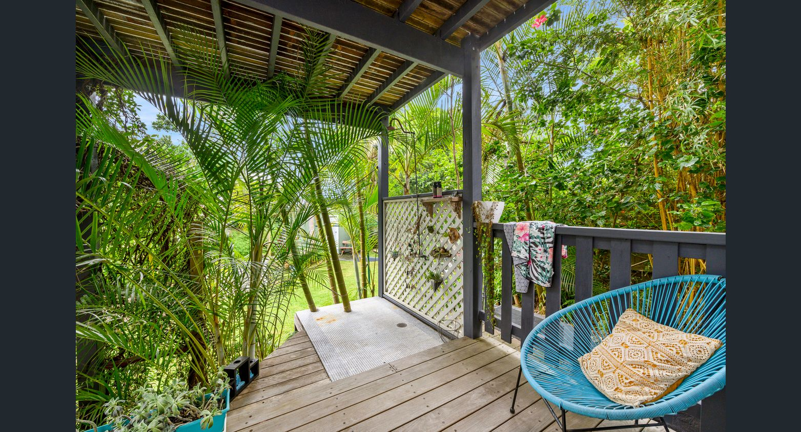 Deck with outdoor shower off main guest bedroom