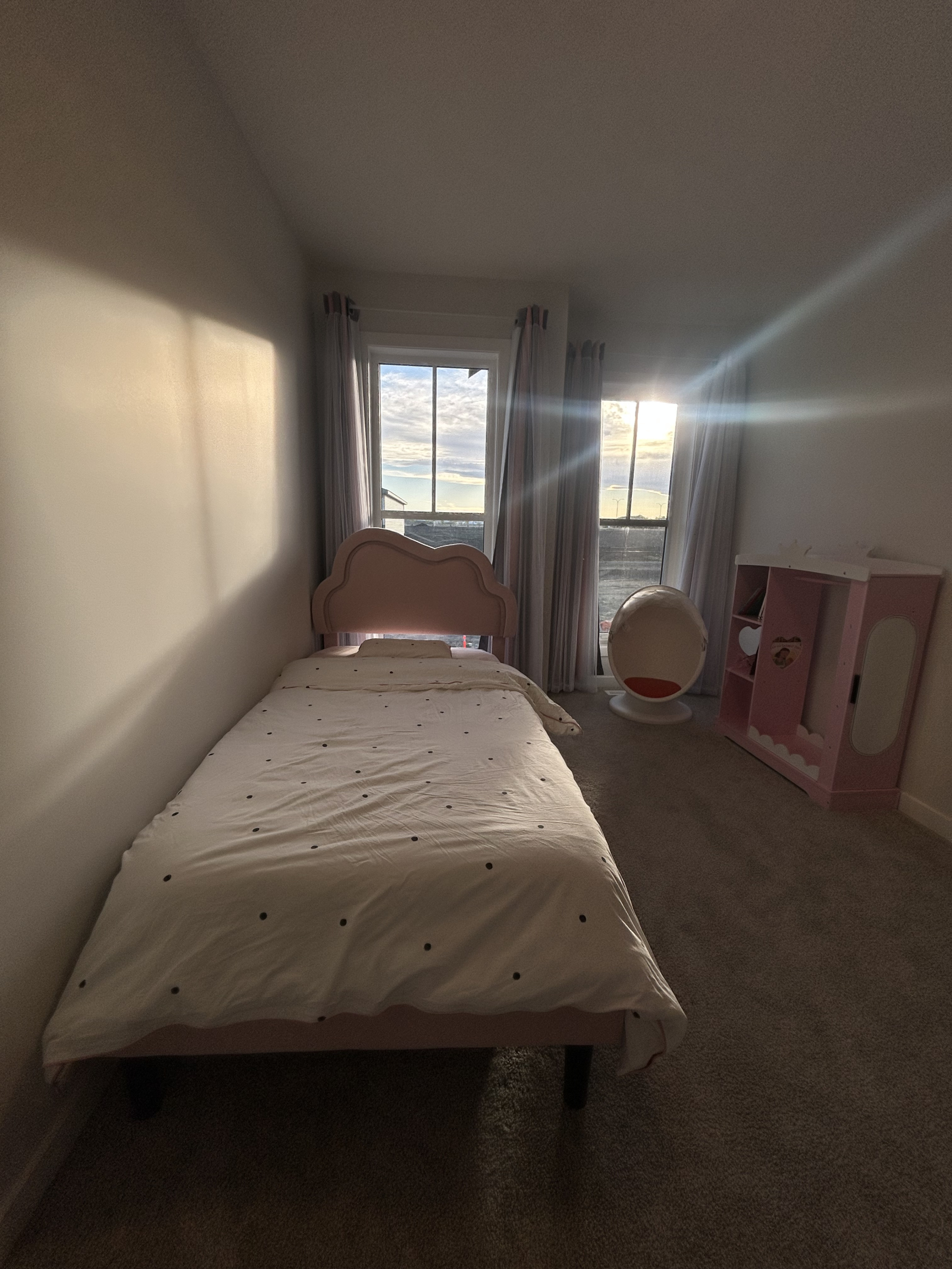 Comfortable and playful space with a twin bed, toy collection, and kids’ books for bedtime stories