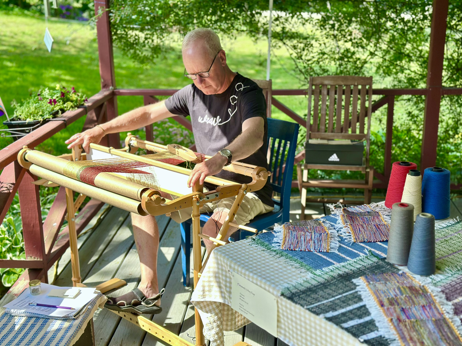 Ross weaving on the porch during the Peaks “Art on the Porch” sale.