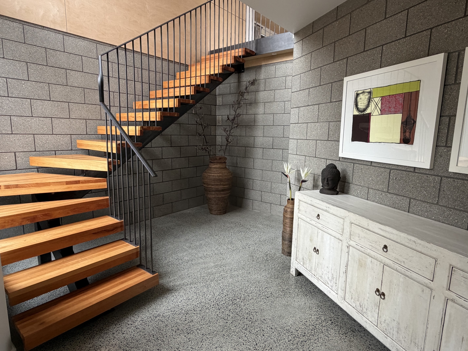 Stairs lead from the from door and garage to the main part of the house.