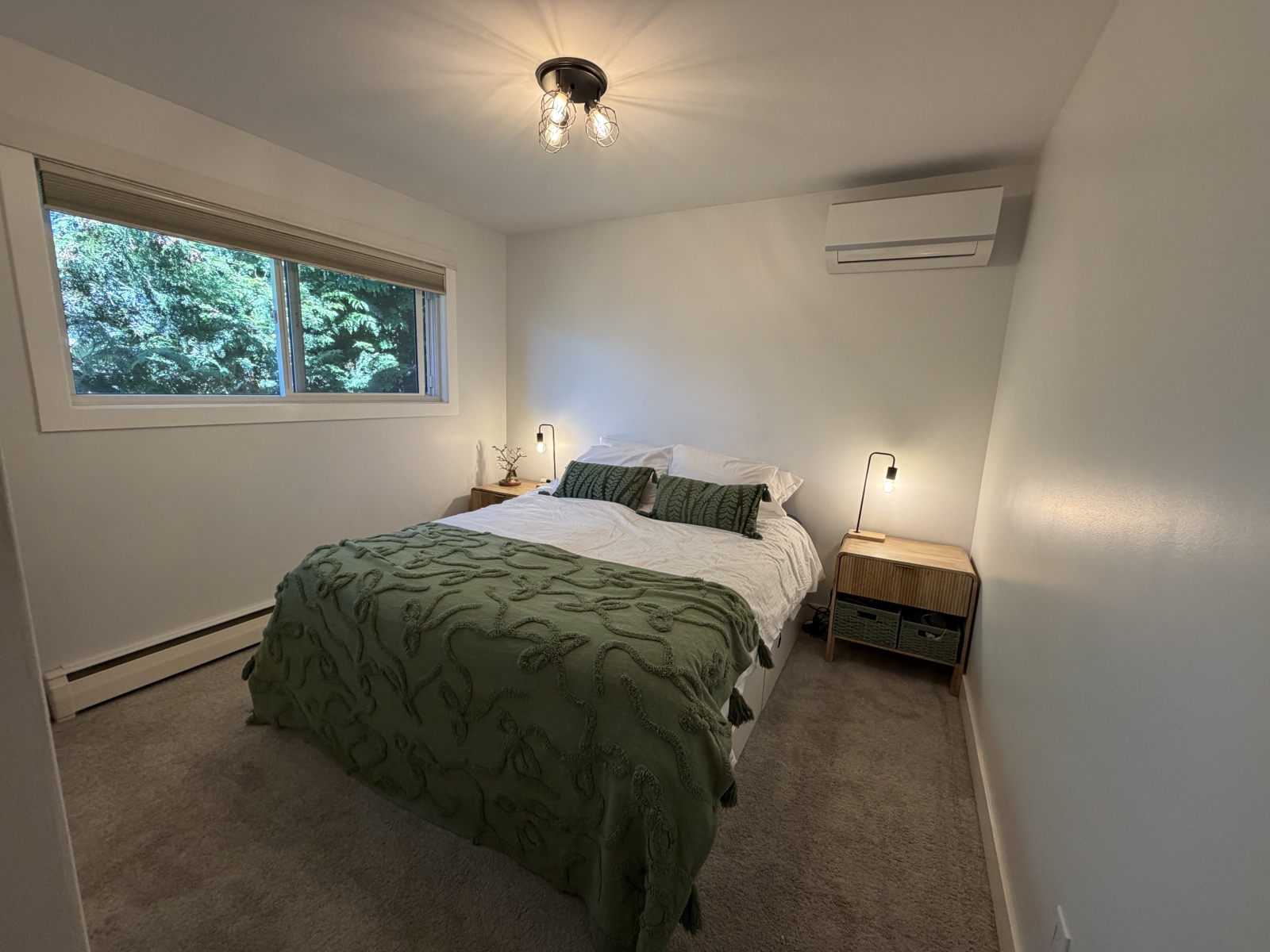 Master bedroom with queen bed and ensuite (sink and toilet, no shower).