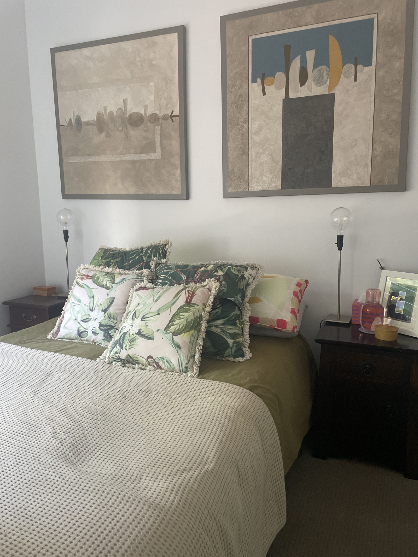 Bedroom three which has a queen bed. Jim Birkett art works