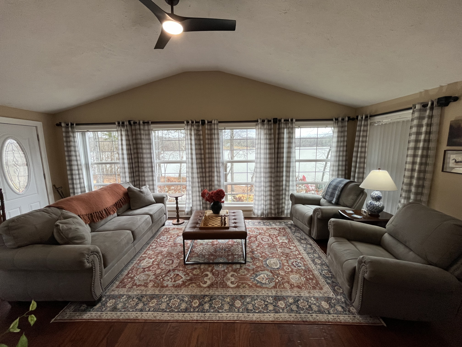 Comfortable living room with oversized recliners and lovely views.