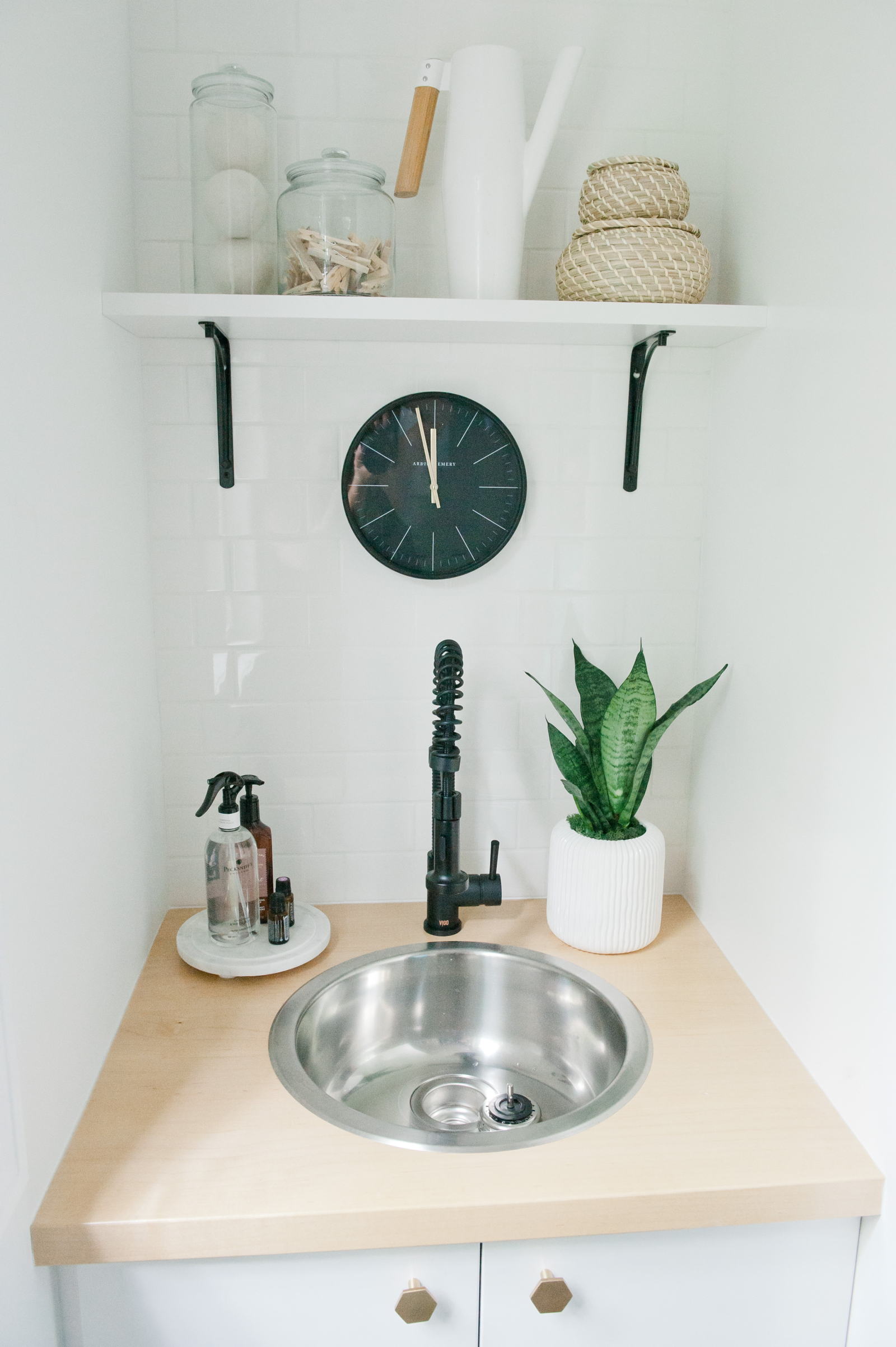 Small sink in the mudroom for soaking laundry items