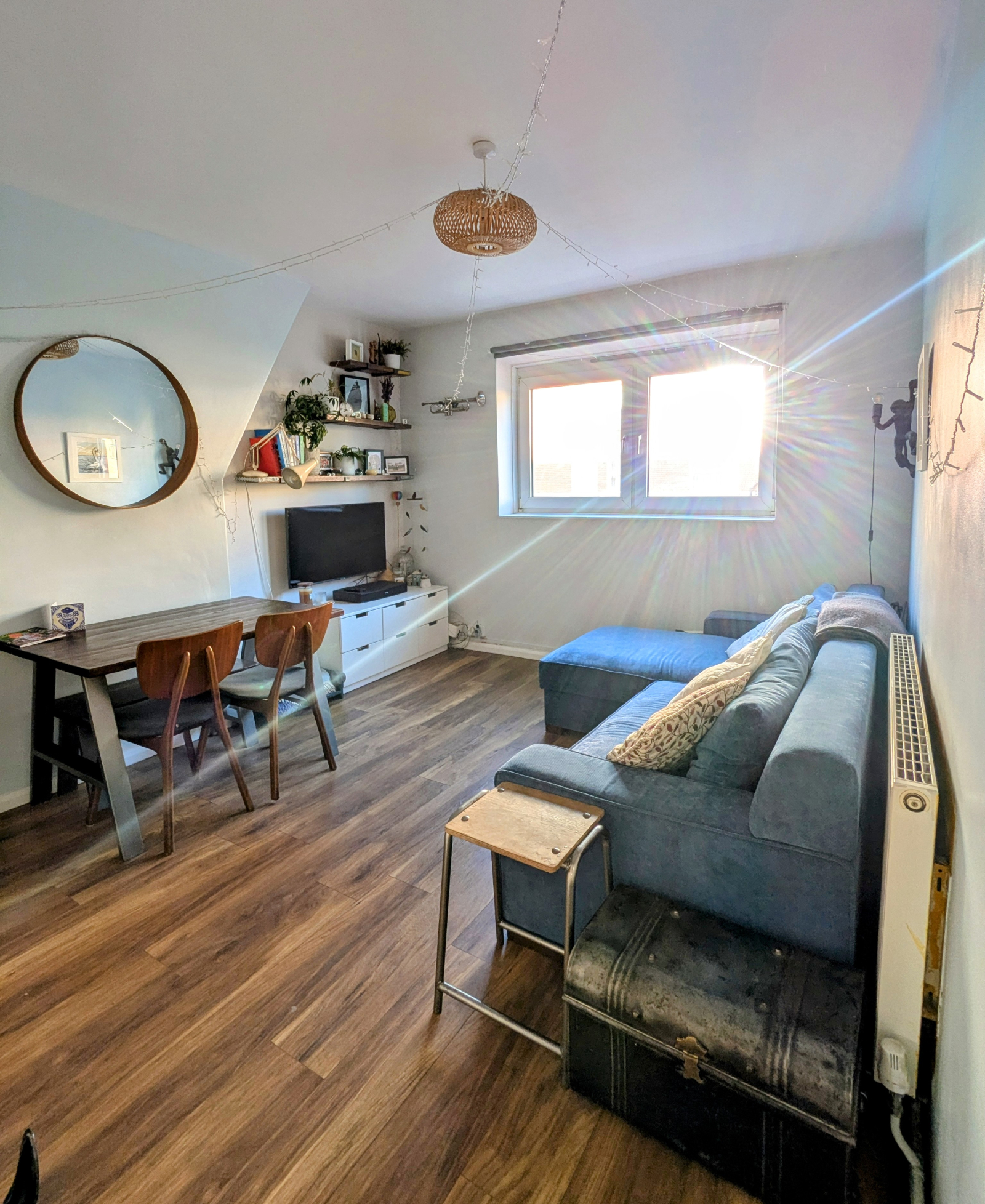 Living room, table which sits 4 around it (a bench is underneath), and sofa bed which pulls out to s ...