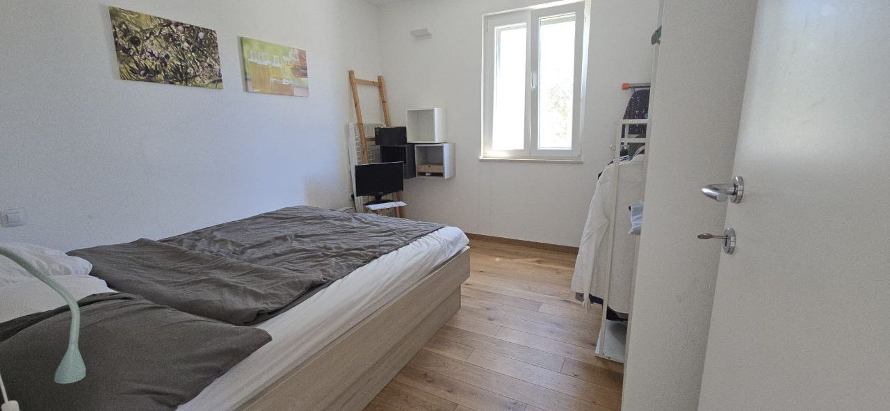 2nd bedroom. Same double size bed, 2 wardrobes on the right.