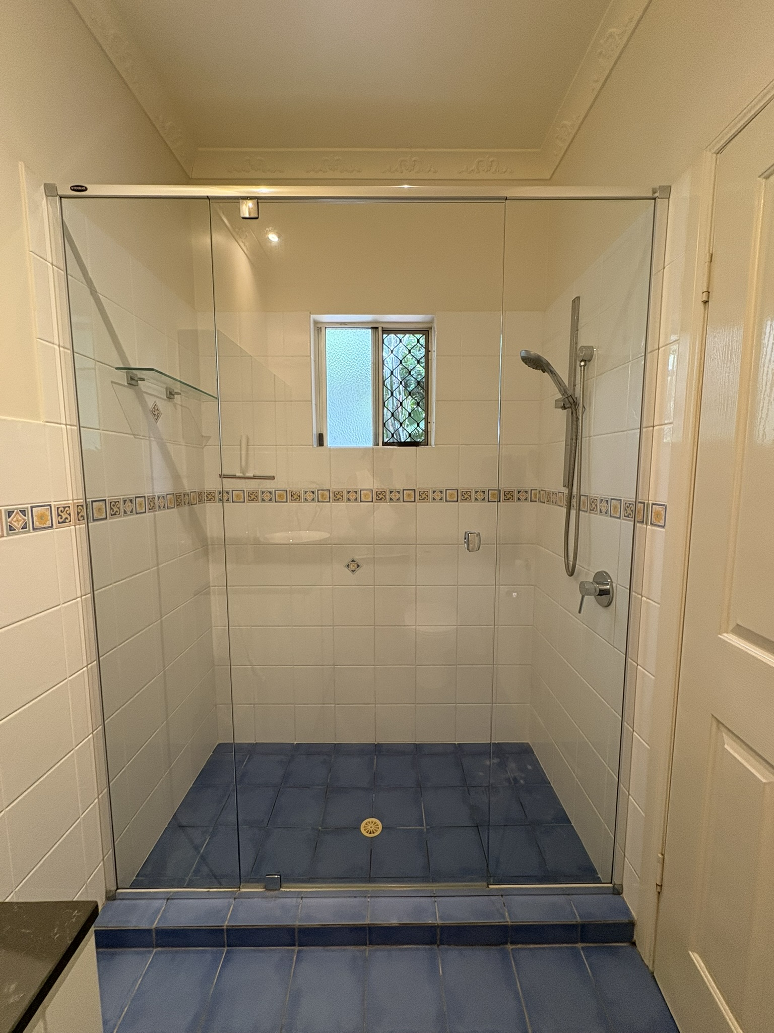 En-Suite shower with window to backyard
