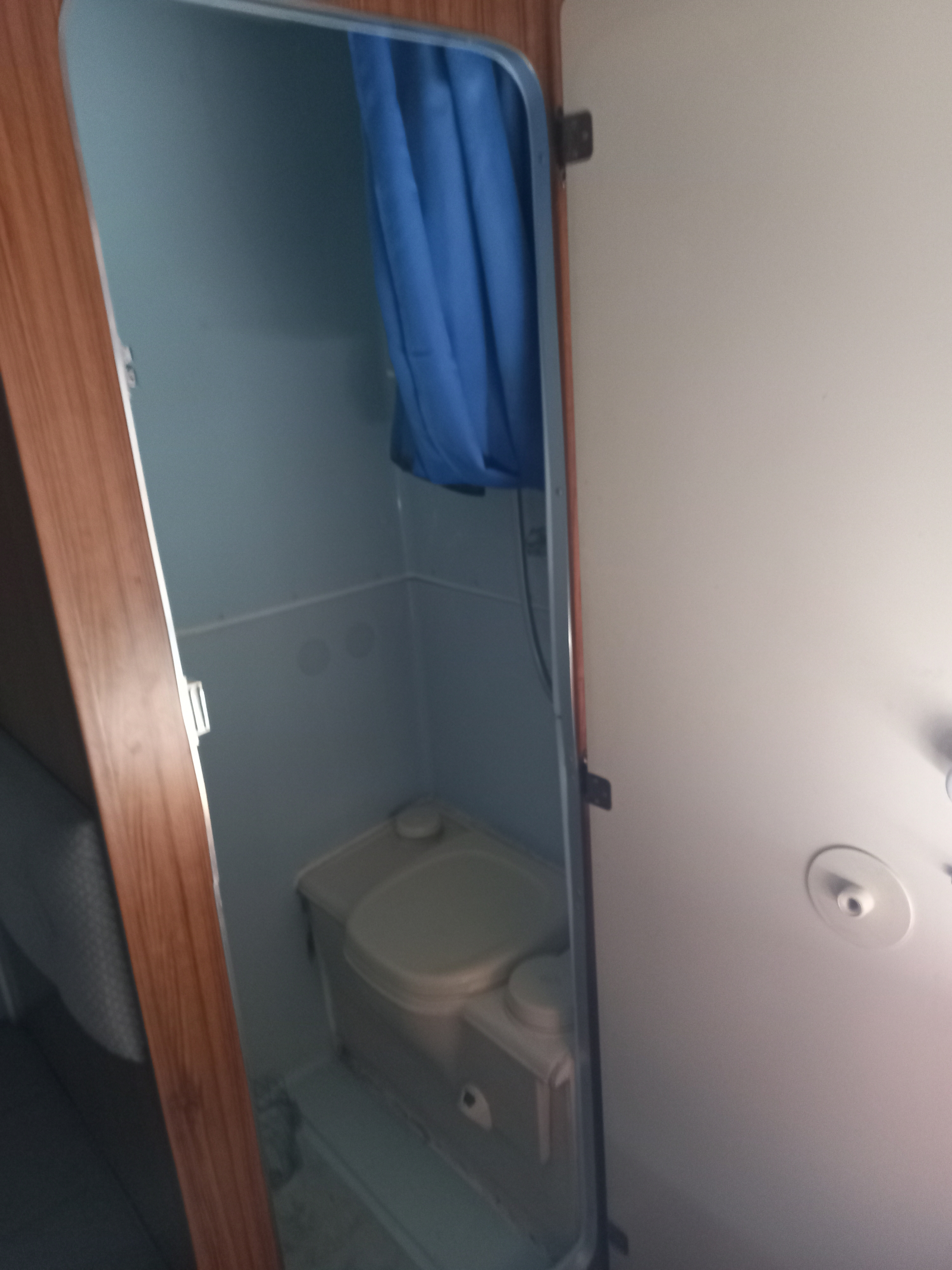 Small shower and toilet space. As water is carried in an on board storage tank showers need to be sh ...