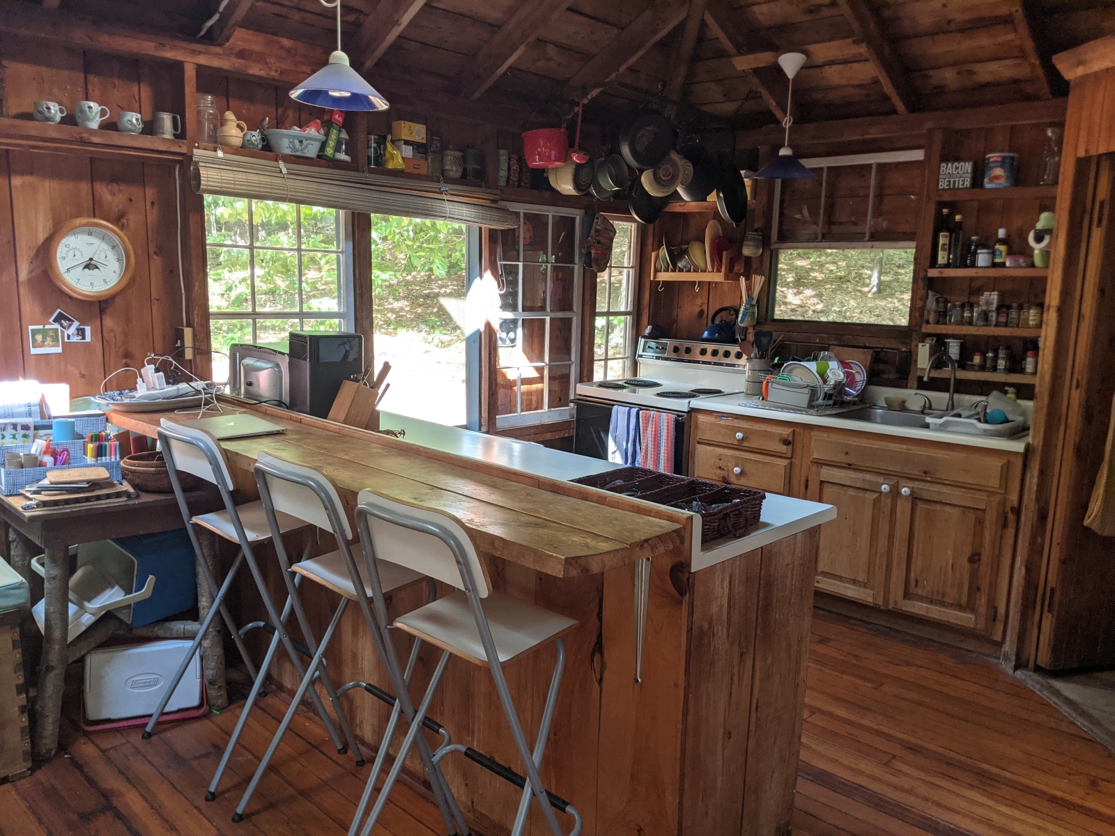 Family cabin at former sleepaway camp with docks, kayaks, and field