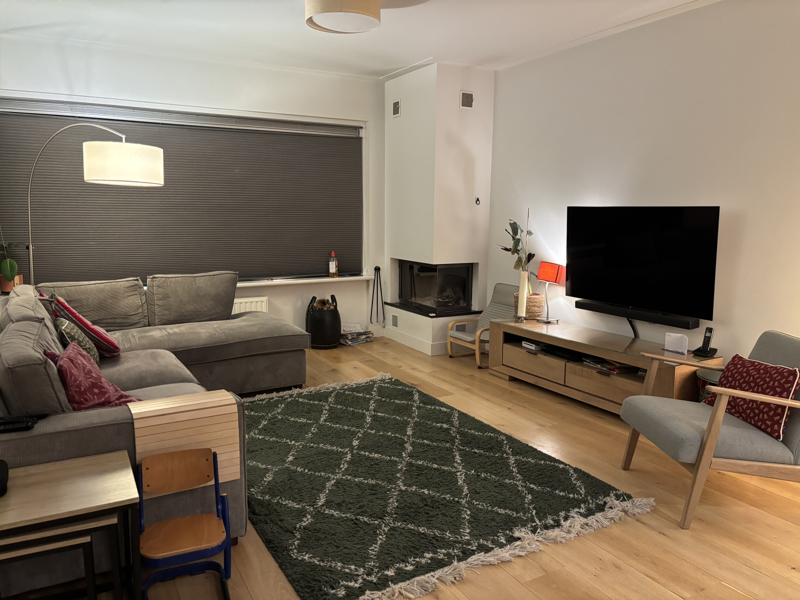 Living/family room with tv and wood burning fire place