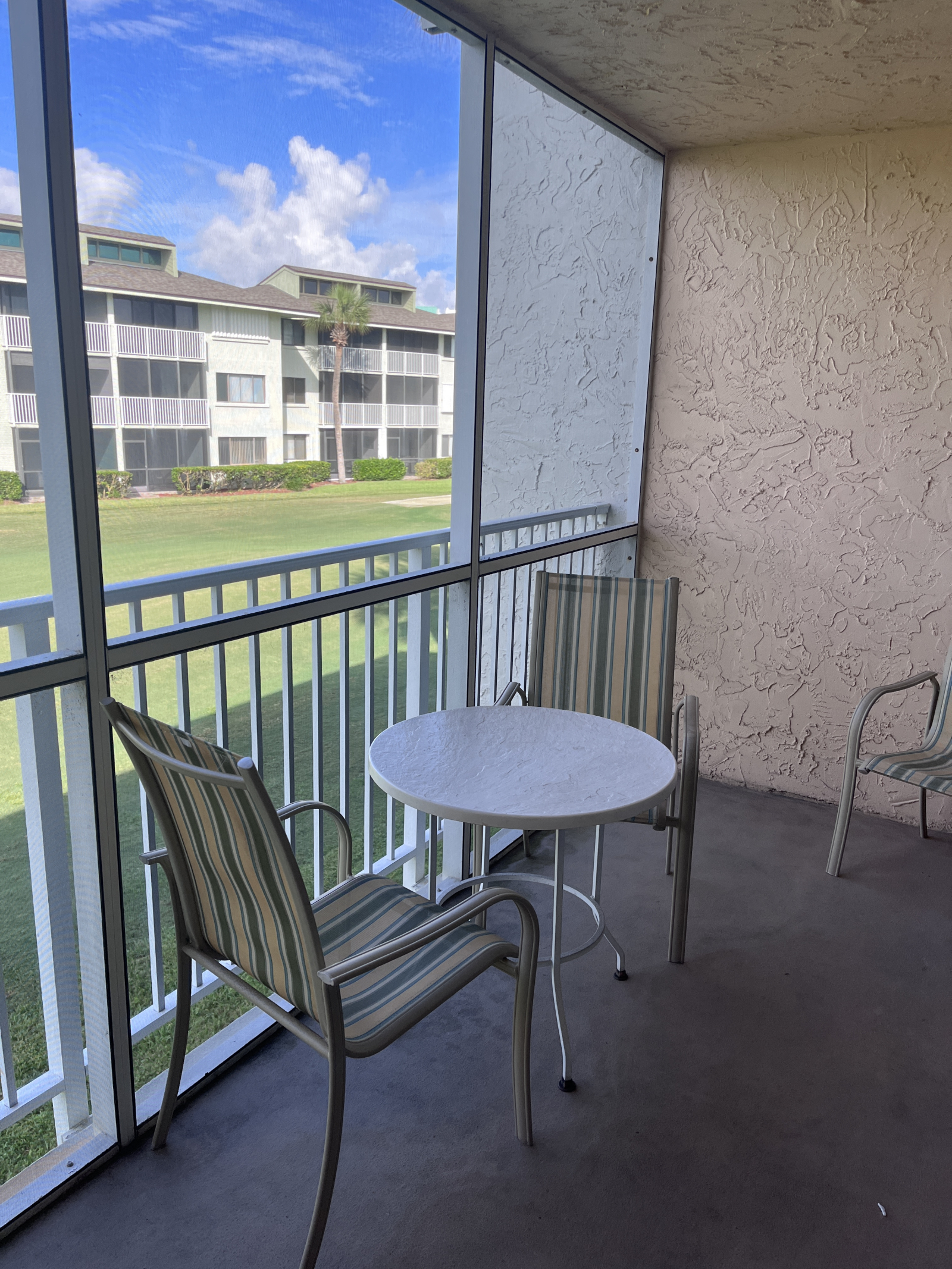 Sreened Lanai ( Covered Porch) overlooking the golf course