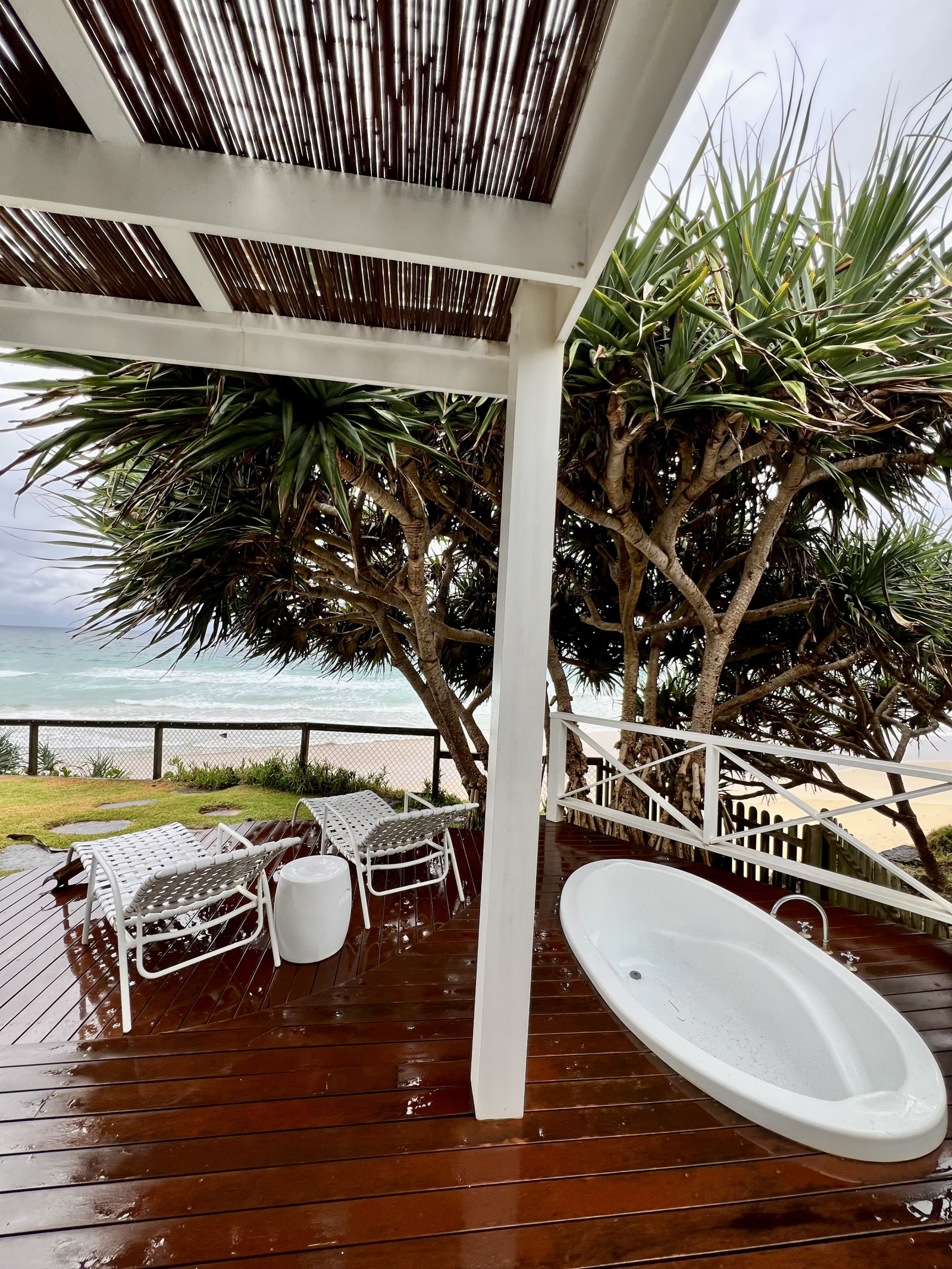 Outdoor bath with hot water and beach view