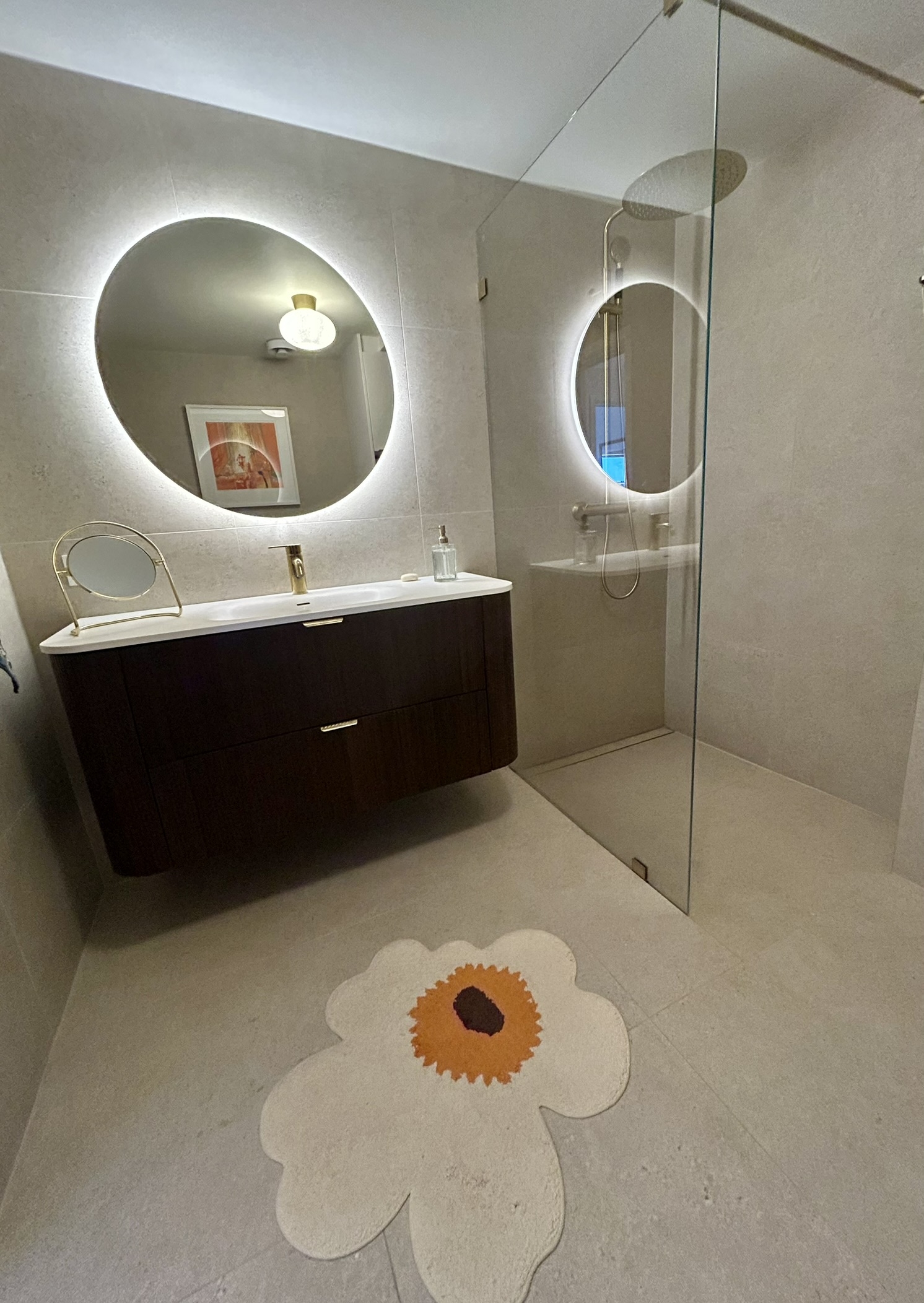 Modern, newly renovated bathroom with underfloor heating and a rainfall shower