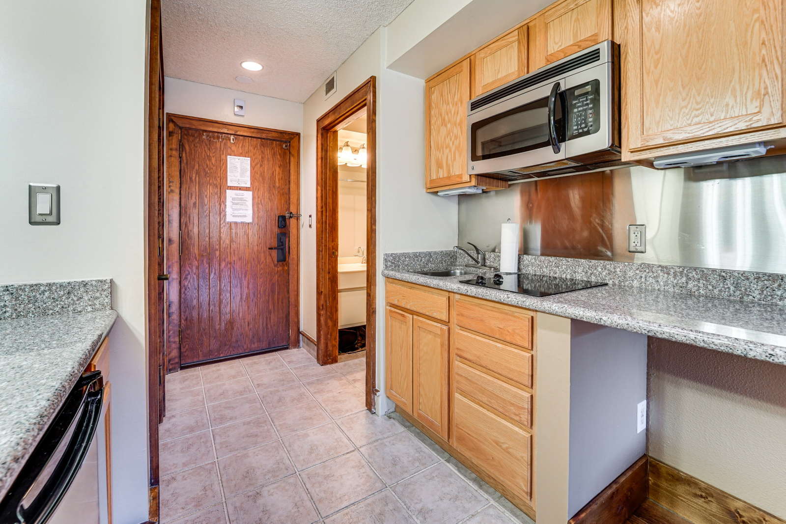 The simple, well appointed kitchenette has a two burner stove, small fridge/freezer, coffee pot, toa ...