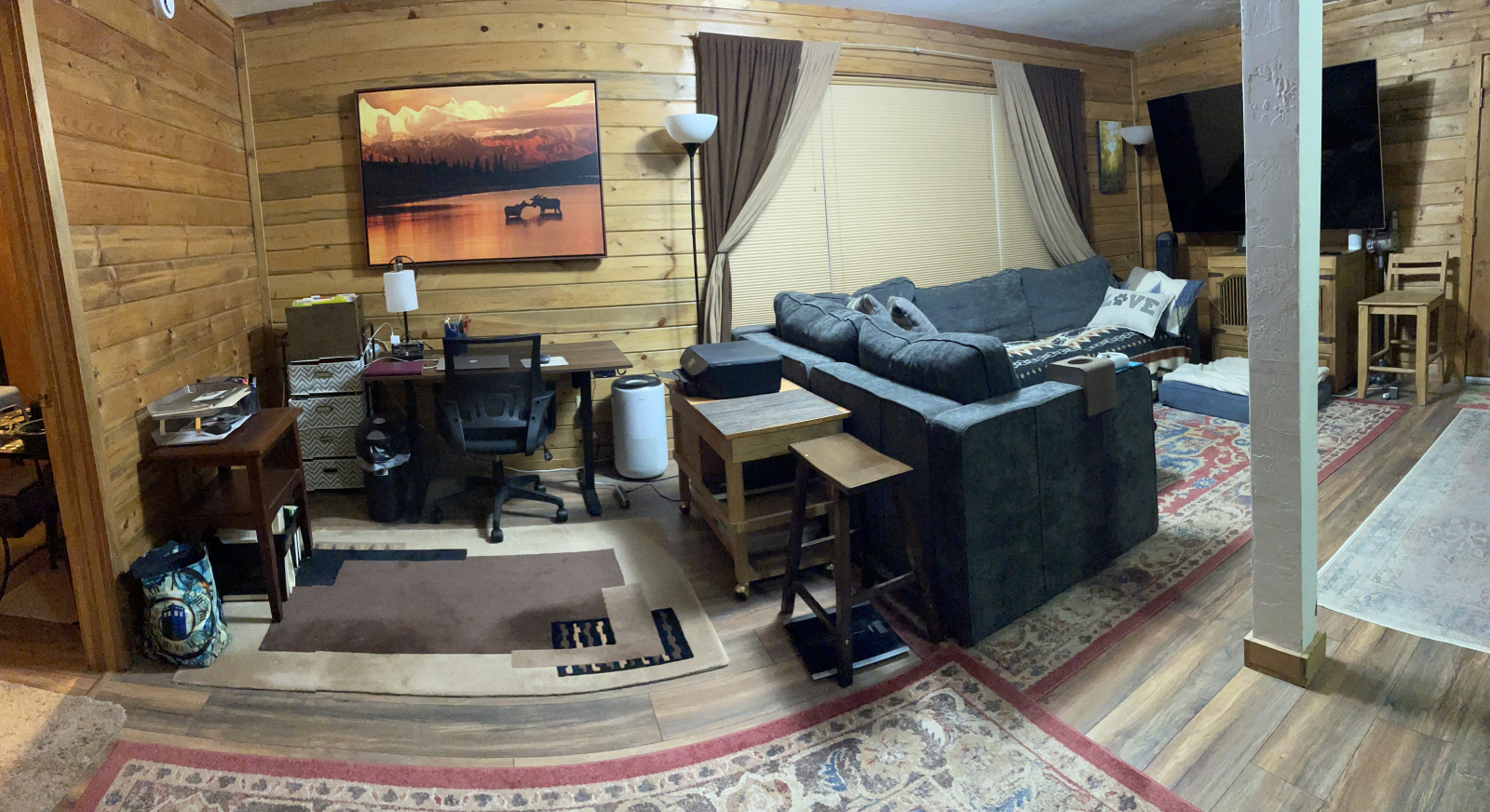 Workspace includes multi level desk (standing or sitting) and a printer.