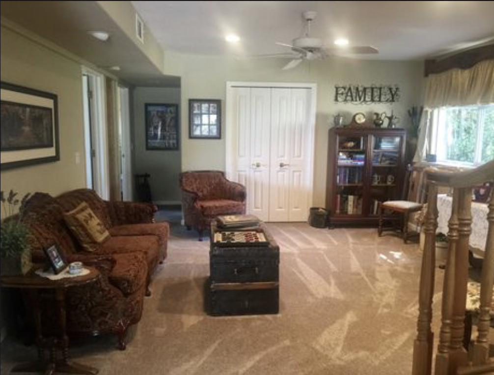 Downstairs living room....Two bedrooms down there as well as a large bathroom, and an office/laundry ...