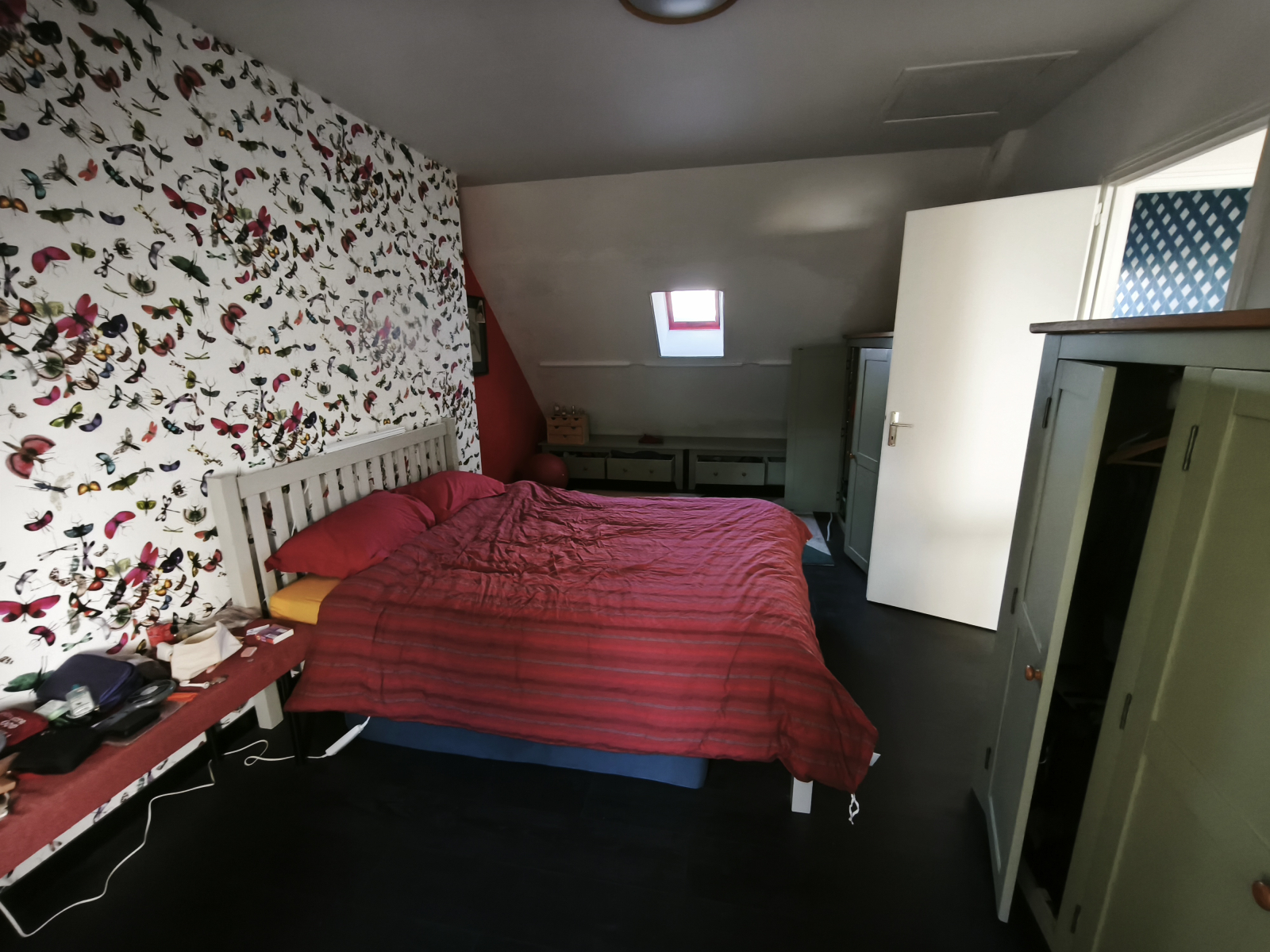 1st double bedroom with drawers and cupboards.