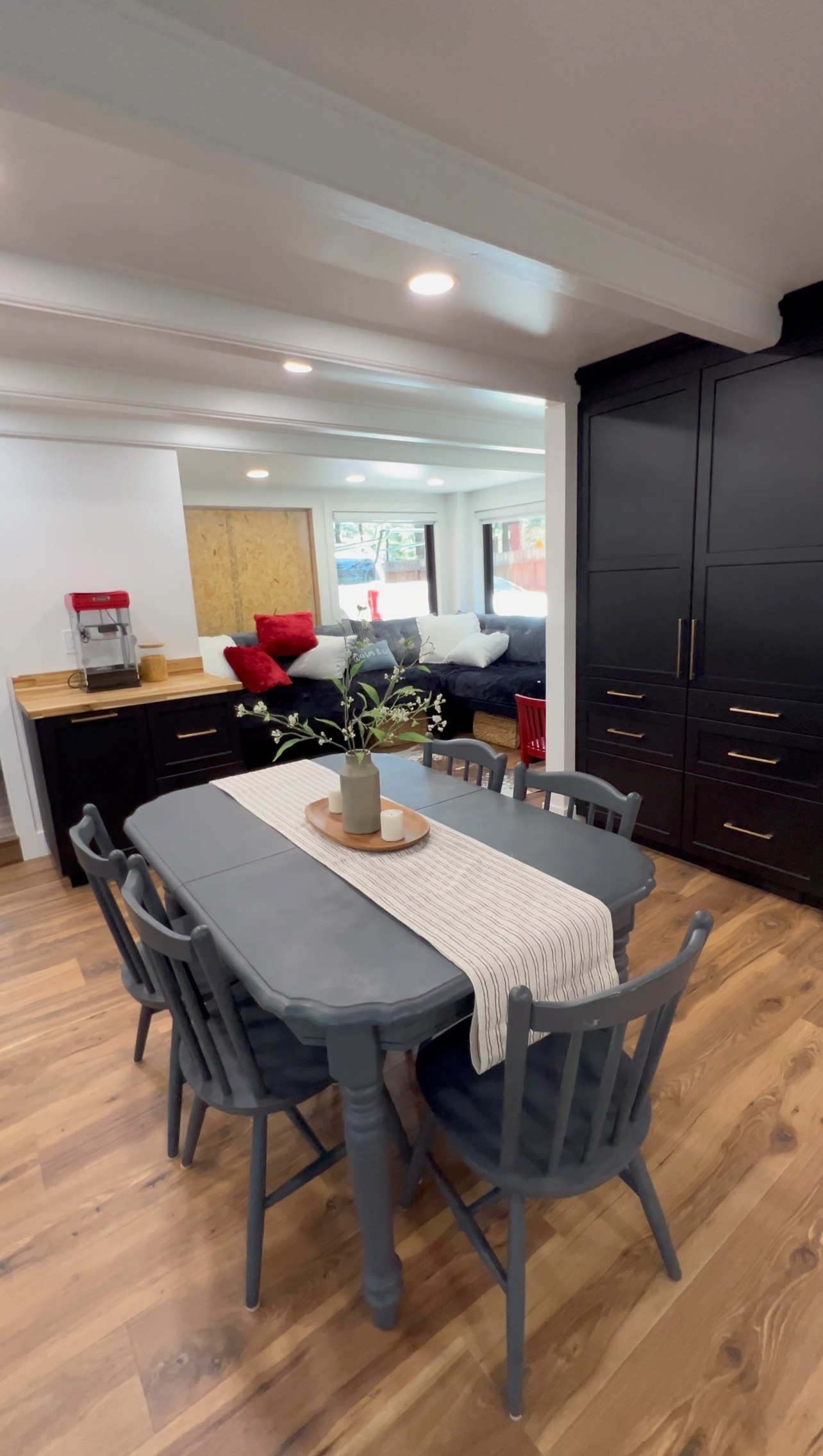 another view of back of cabin with a large built in lounging area (window being replaced mid-June).