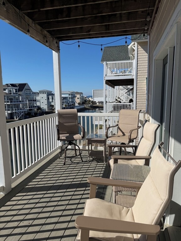 In addition to the table, there’s comfortable seating on the back porch as well. Perfect place to relax and read a book and watch turtles in the pond below.