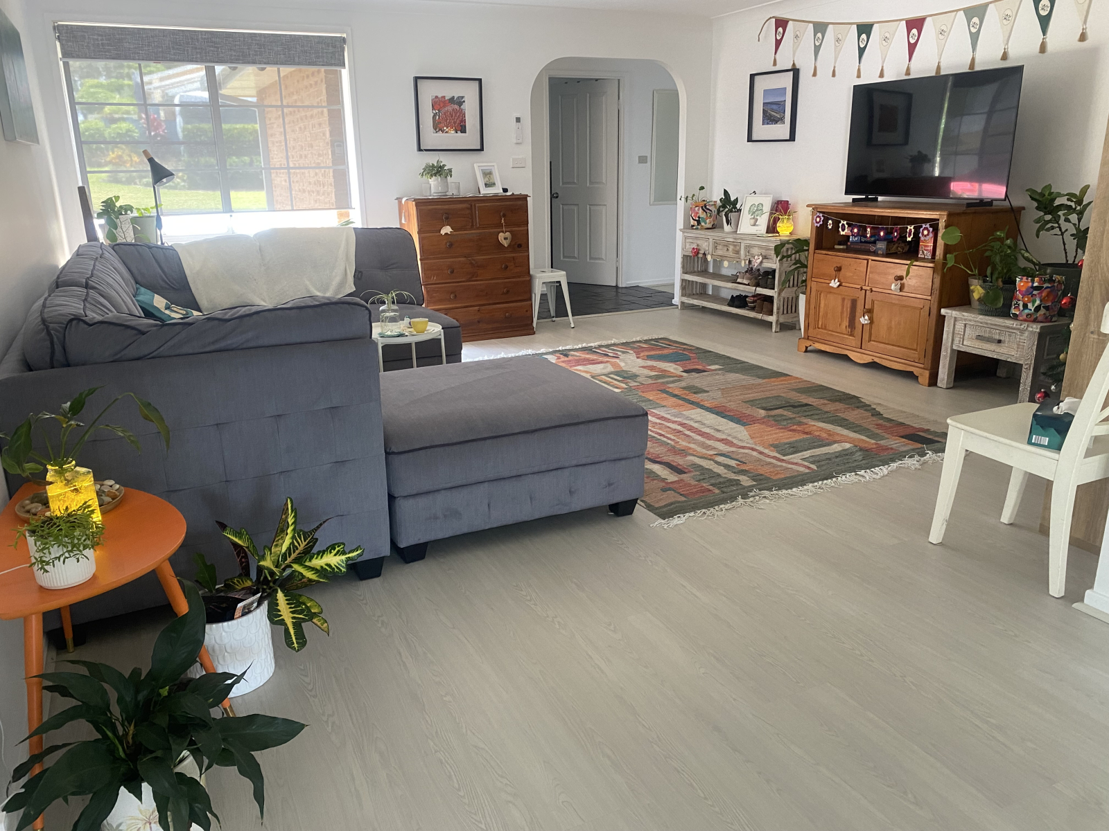 Main living area with corner lounge and second television