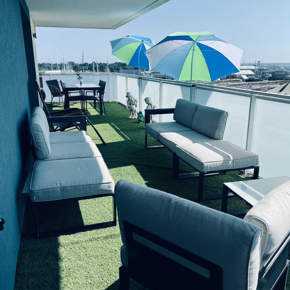Large terrace with views of the port and the sea.