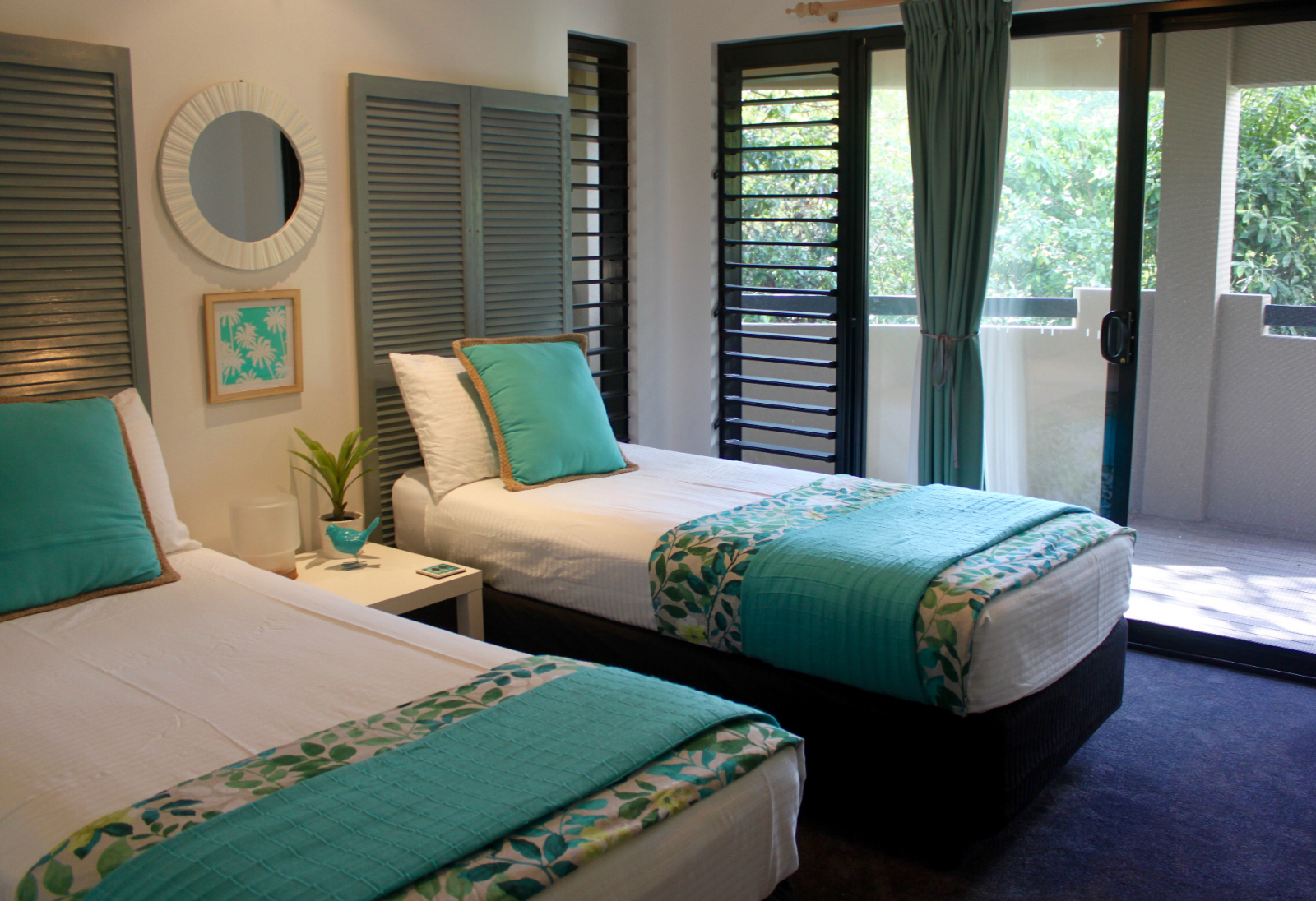 Blue bedroom - 2 king single beds, opening on to deck