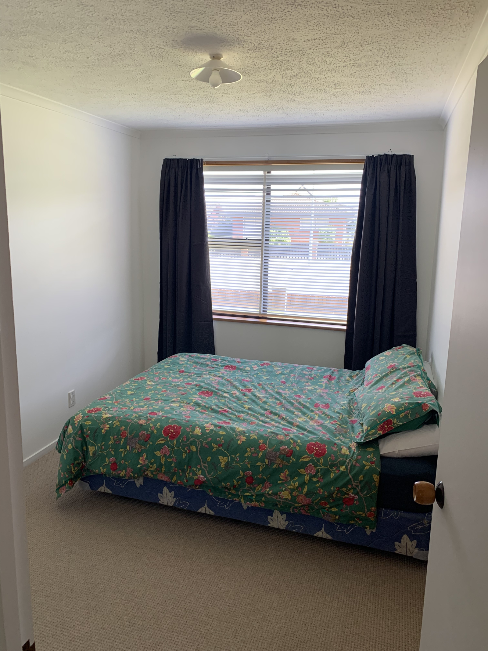 Bedroom 2 with queen sized bed, large double wardrobe, set of shelves and thermal black-out curtains ...