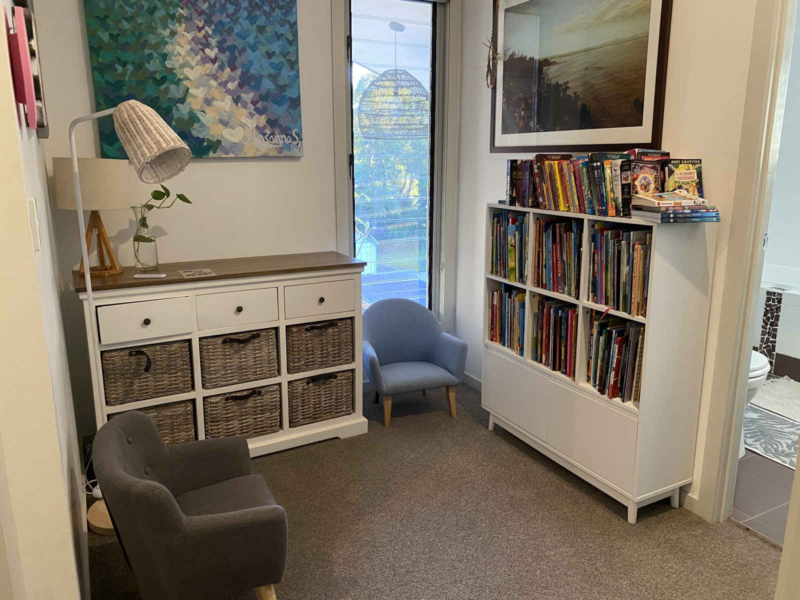 Reading nook just outside the kids' bedrooms with lots of children's picture books and chapter books ...