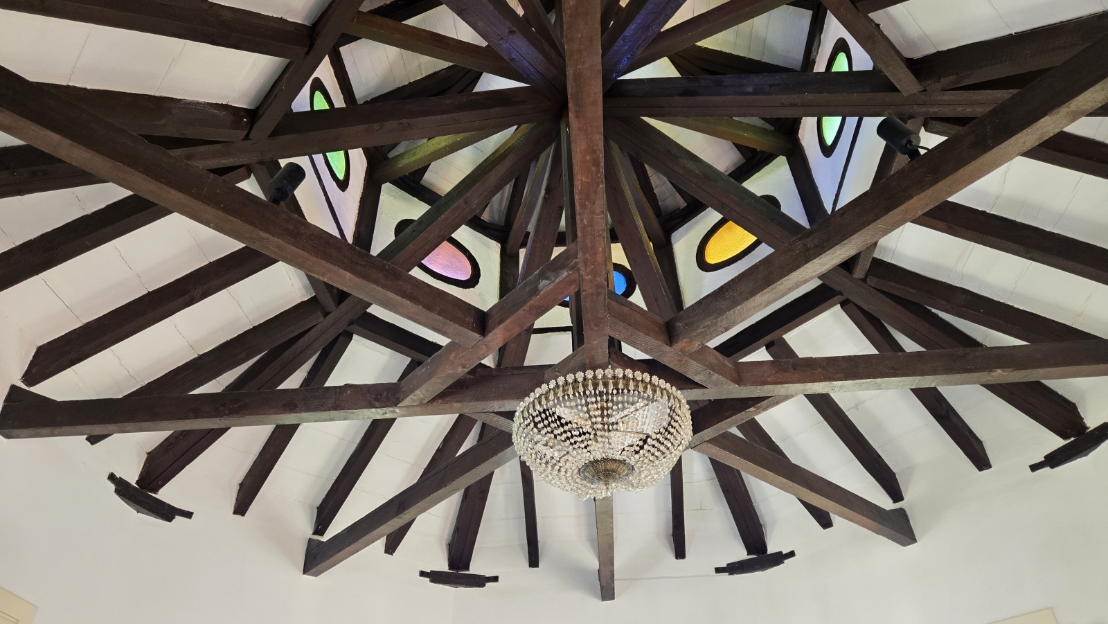 The wonderful turret ceiling with beams and stained glass windows