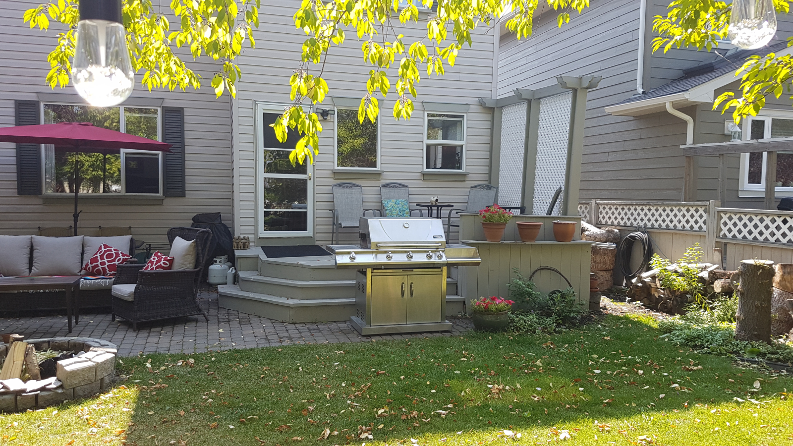 Cozy back yard with plenty of things to do for adults and children.