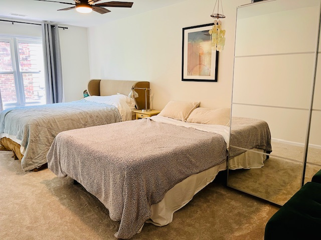 First floor guest room with two queen beds and attached full bath