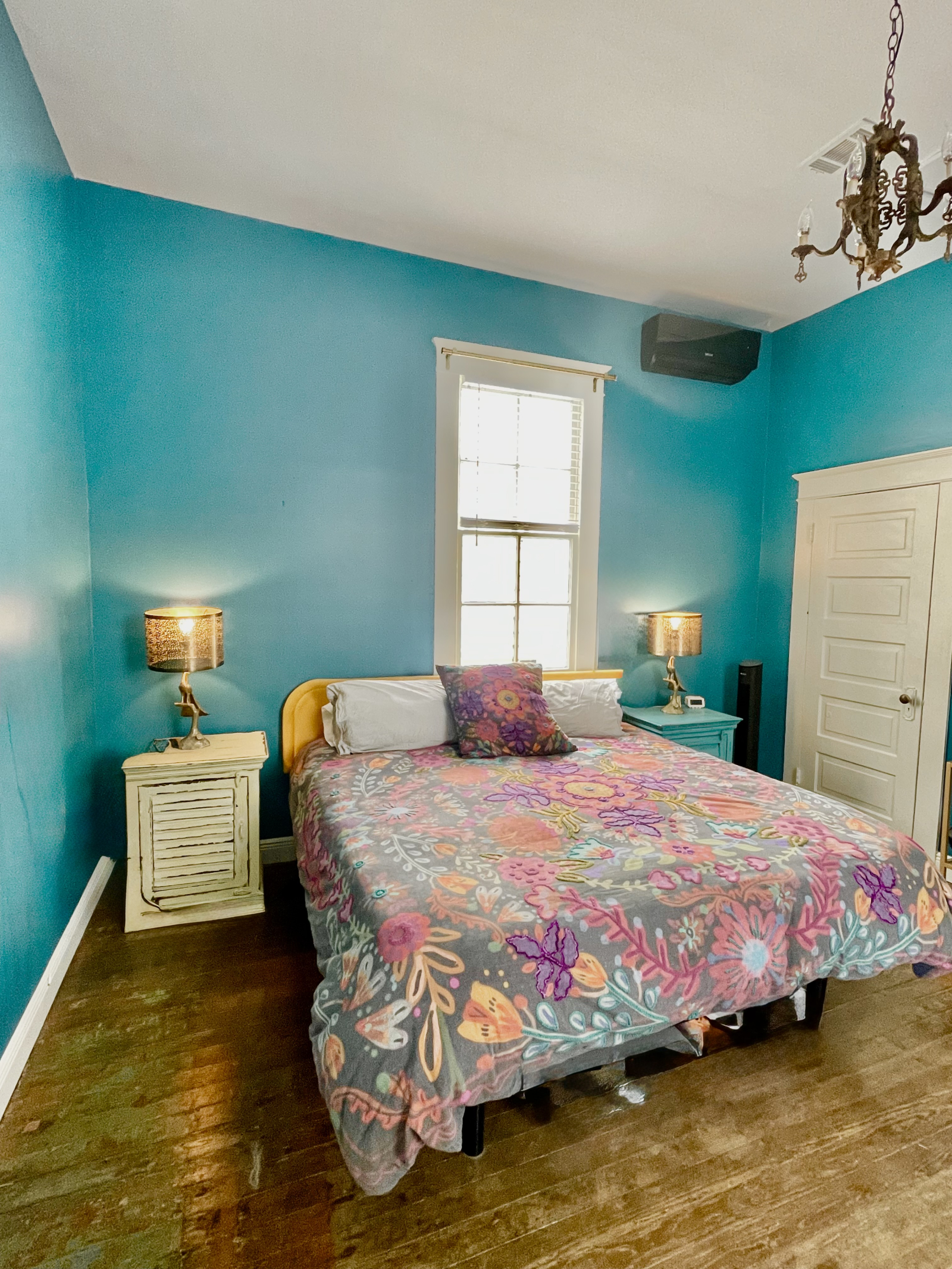 Primary bedroom with a mini split air conditioner unit that keeps the back bedroom nice and cool. The bedroom has blackout curtains and is nice and quiet being at the back of the house.