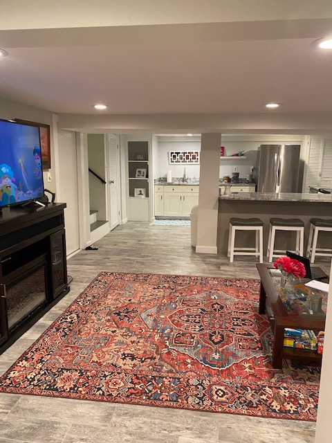 Living room. Couch to the right and a pull out bed/couch behind.