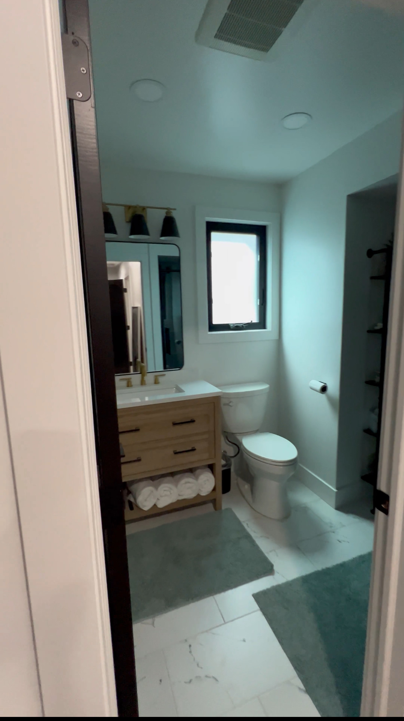 New game room/bunk room bathroom with large shower