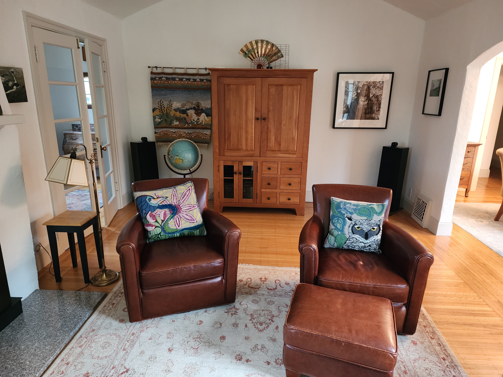 Comfy living room chairs swivel to watch TV in the wood cabinet (which also has our stereo system an ...